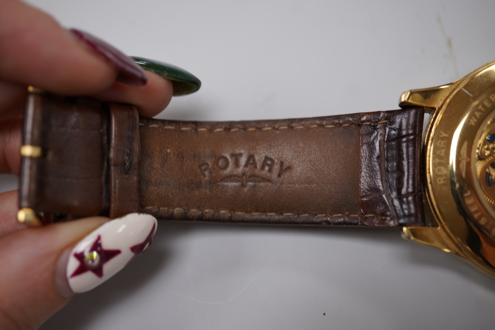 Four assorted gentleman's recent wrist watches including gilt stainless steel Rotary with visible escapement, Sekonda and Seiko.